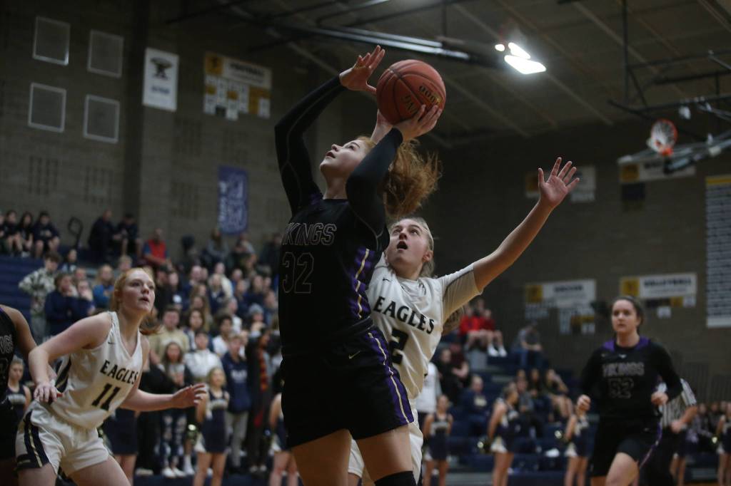 Lake Stevens Cori Wilcox goes for a shot at the basket as the Arlington Eagles lost to the Lake Stevens Vikings 57-54 in a girls basketball game on Friday, Dec. 6, 2019 in Arlington, Wash. (Andy Bronson / The Herald)