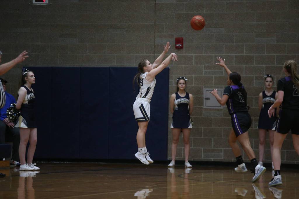 Arlingtons Allison DeBerry shoots a three-point shot as the Arlington Eagles lost to the Lake Stevens Vikings 57-54 in a girls basketball game on Friday, Dec. 6, 2019 in Arlington, Wash. (Andy Bronson / The Herald)