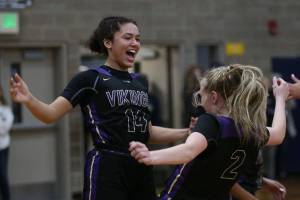 Lake Stevens Baylor Thomas and teammate Chloe Pattison celebrate as the Arlington Eagles lost to the Lake Stevens Vikings 57-54 in a girls basketball game on Friday, Dec. 6, 2019 in Arlington, Wash. (Andy Bronson / The Herald)