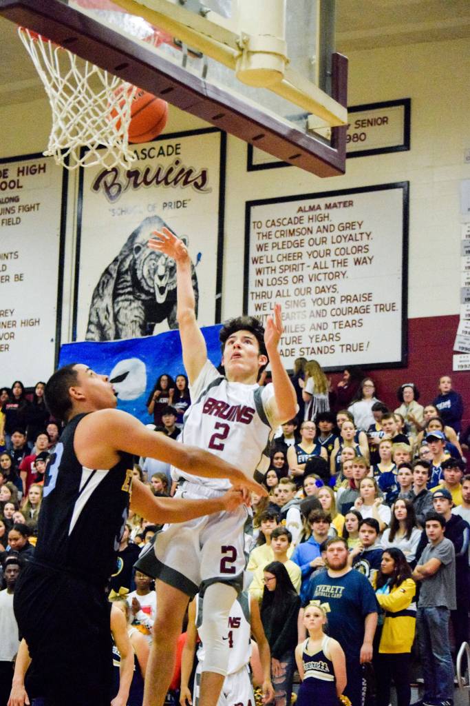 Cascades Aidan Davis (2) shoots the ball against Everett on Friday, Dec. 6 at Cascade High School in Everett. (Katie Webber / The Herald)