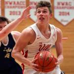 Marysville-Pilchucks Aaron Kalab drives to the basket with Kelsos Riley Noah trailing Saturday afternoon at Everett Community College on February 22, 2019 in Everett. The Tomahawks won 72-51 to advance to the Tacoma Dome. (Kevin Clark / The Herald)