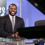 Femi Abebefe, a 2008 graduate of Everetts Cascade High School, sits at the anchor desk at Seattles KOMO 4 News. Abebefe, 29, is the channels weekend sports anchor. (Kevin Clark / The Herald)