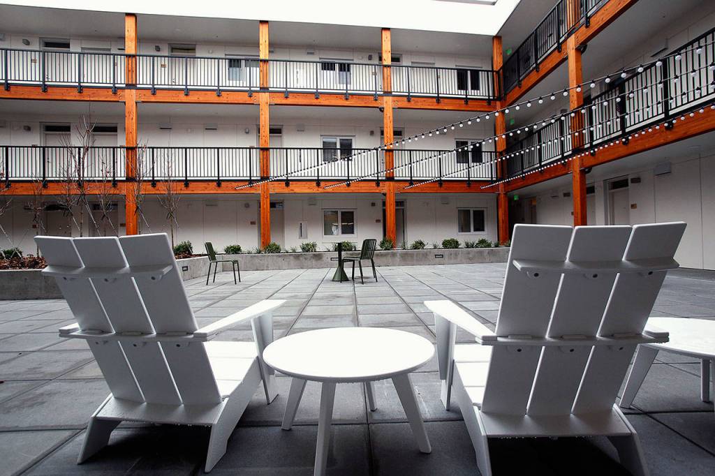 The 65-unit apartment complex that is part of HopeWorks Station on Broadway in Everett is designed around a secure, comfortable courtyard. Many of its residents are people working to turn their lives around. The apartments are upstairs from the new Kindred Kitchen. (Dan Bates / The Herald)