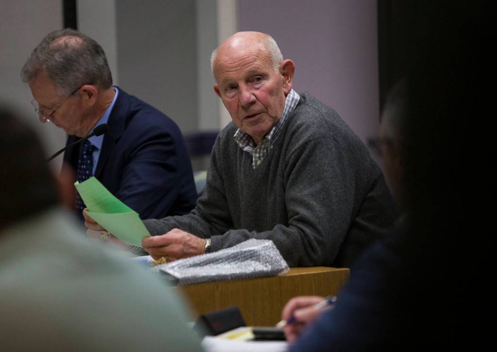 Lake Stevens Mayor John Spencer reads names of people signed up to speak during the Lake Stevens City Council meeting on Tuesday. (Olivia Vanni / The Herald)