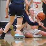 Snohomishs Gracie VanAssche throws a pass from the floor after grabbing the loose ball in the Panthers 50-39 loss to rival Glacier Peak in a non-league girls basketball game on Monday, Dec. 9, 2019 in Snohomish, Wash. (Andy Bronson / The Herald)
