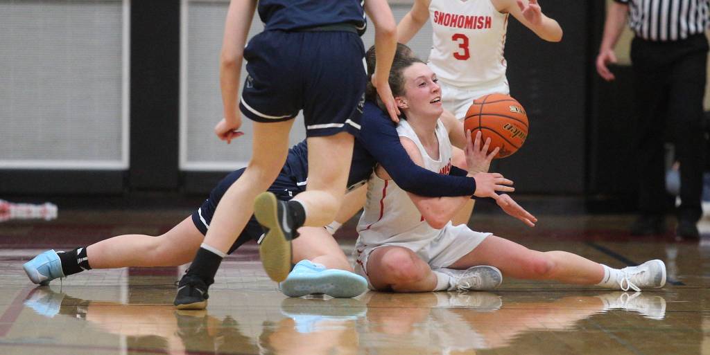 Snohomishs Gracie VanAssche throws a pass from the floor after grabbing the loose ball in the Panthers 50-39 loss to rival Glacier Peak in a non-league girls basketball game on Monday, Dec. 9, 2019 in Snohomish, Wash. (Andy Bronson / The Herald)