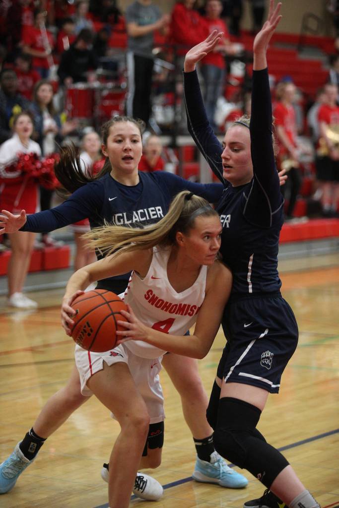 Snohomishs Kinslee Gallatin is defended by Glacier Peaks Maya Erling and Madison Rubino in the Grizzlies 50-39 victory over rival Snohomish in a non-league girls basketball game on Monday, Dec. 9, 2019 in Snohomish, Wash. (Andy Bronson / The Herald)