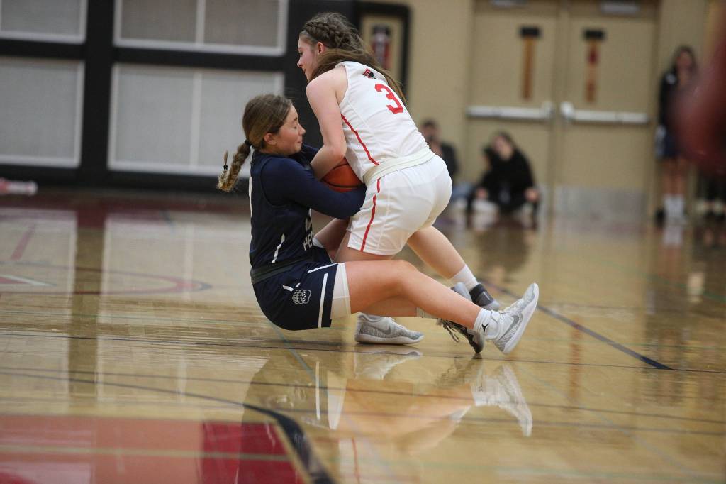 Glacier Peaks Malia Smith and Snohomishs Cheyenne Rodgers battle for the ball as Glacier Peak topped rival Snohomish 50-39 in a non-league girls basketball game on Monday, Dec. 9, 2019 in Snohomish, Wash. (Andy Bronson / The Herald)