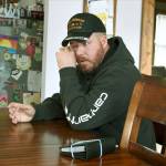 Gabe Steele wipes his eye as he sits in his home Nov. 1 in West Point, Iowa, and talks about the accidental fatal shooting of his wife, Autumn Steele, by a Burlington, Iowa police officer in 2015. (AP Photo/Matthew Holst)