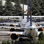 In this Aug. 15 photo, three grounded Boeing 737 Max airplanes, built for Icelandair, sit parked in a lot normally used for cars in an area adjacent to Boeing Field, in Seattle. (AP Photo/Elaine Thompson, File)