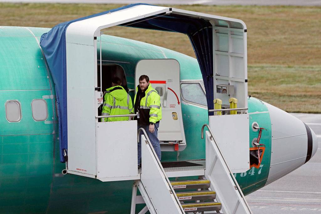 Workers enter a Boeing 737 Max airplane being built for Aeromexico on Wednesday at Renton Municipal Airport in Renton. (AP Photo/Ted S. Warren)