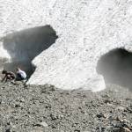 Hikers take in the sites of the Big Four Ice Caves in Granite Falls on July 12, 2018. (Kevin Clark / Herald file)
