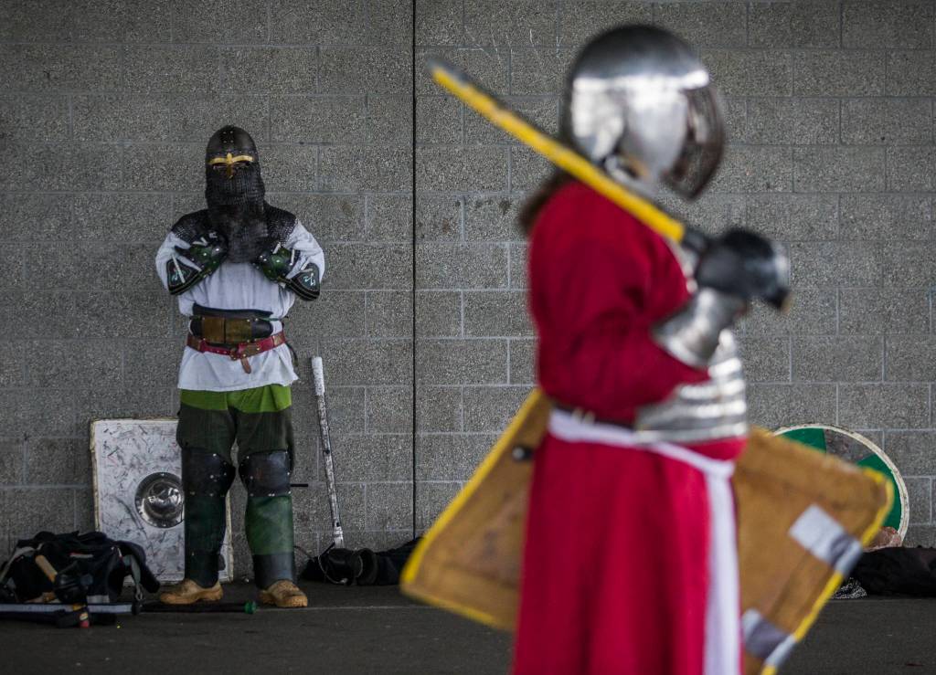 Derek Stump puts on his armor before combat practice. LARPers from around Washington will converge on the Evergreen State Fairgrounds on Jan. 25-26 for the Ursulmas Medieval Faire. (Olivia Vanni / The Herald)