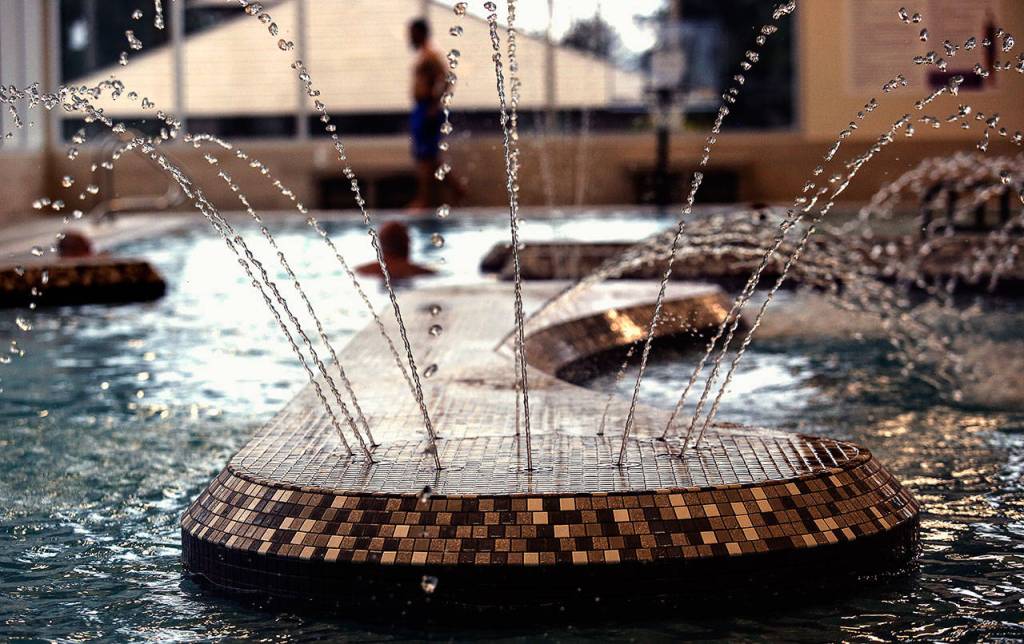 The new Everett Family YMCAs aquatic facility includes a lazy river, shown here, where people can swim or walk with a current, a zero-entry beach area with water features for children, and a 25-yard lap pool. (Dan Bates / The Herald)