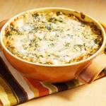 Cream cheese and thickened milk make this warm crab and spinach dip delightfully creamy but not overly rich. (Tom McCorkle / for The Washington Post)