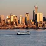 Downtown Seattle buildings light-up at sunset as a Washington state ferry heads across Elliott Bay its terminal on Nov. 20. A new report shows that Puget Sound is on par with California in the earthquake danger zone. (AP Photo/Elaine Thompson)