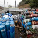 Dozens of barrels fill an outside storage area at Seattle Barrel and Cooperage on Wednesday in Seattle. (AP Photo/Elaine Thompson)