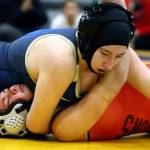 Arlingtons Raina Allen wrestles and pins Snohomishs Hannah Wheeler Wednesday evening at Arlington High School in Arlington on December 18, 2019. Arlington won 66-18. (Kevin Clark / The Herald)