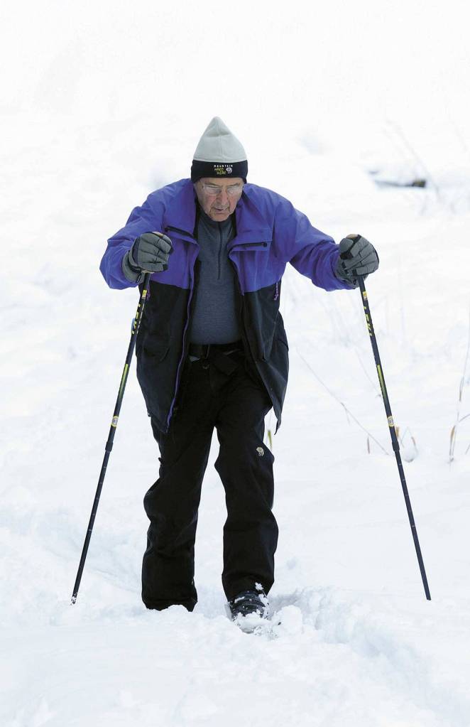 Walt Questad, of Edmonds, makes his way through fresh snow. (Ian Terry/Herald file)