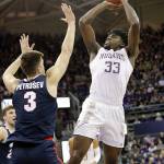 Washingtons Isaiah Stewart (33) shoots over Gonzagas Filip Petrusev (3) in the first half of a college basketball game Sunday, Dec. 8, 2019, in Seattle. (AP Photo/Elaine Thompson)