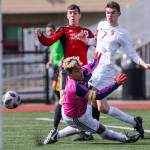 Marysville Pilchucks Kyle Matson (left) charges the net with Snohomishs Adam Kowalchyk (right) and Snohomishs goalkeeper Michael Herrera defending at Quil Ceda Stadium in Marysville on March 23. The match ended in a 1-1 tie. (Kevin Clark / The Herald)