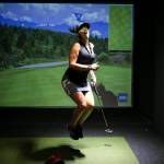 Gina Deutsch reacts to a missed putt as she and a teammate compete on the first day of league play golf at Back9 Parlor on Sept. 10 in Lynnwood. (Andy Bronson / The Herald)
