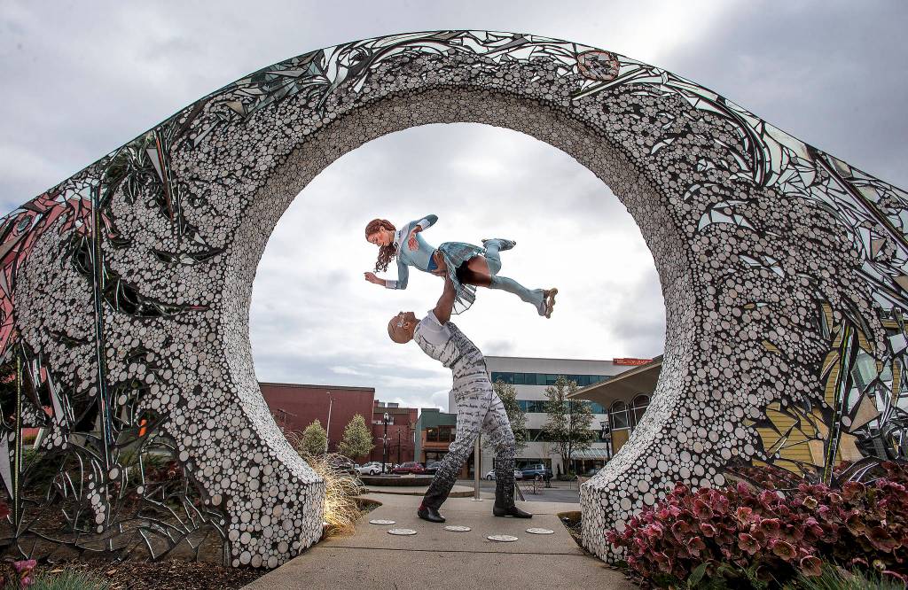 Silja Dos Reis, who plays the role of Crystal, and Jerome Sordillon, who plays the role of the love interest, pose at The Convergence Zone in Stardust plaza at the Wetmore Theater on April 9 in Everett. (Andy Bronson / The Herald)