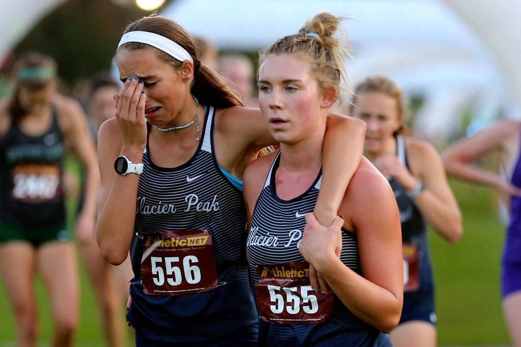 Runners make their way through the course during the 13th Annual Twilight XC Invitational at Cedarcrest Golf Course in Marysville on Oct. 5. (Kevin Clark / The Herald)