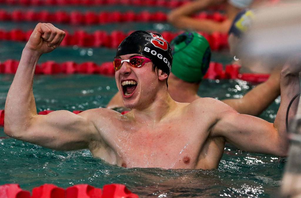 Snohomishs James Boggeri celebrates his first place in the Boys 50-yard freestyle during the NW District 1 3A Boys Swim and Dive at the Snohomish Aquatic Center on Feb. 8. The Jaguars won 84-70. (Kevin Clark / The Herald)