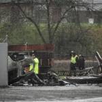 Investigators work at the scene of a vehicle crash that killed Sheriffs Deputy Cooper Dyson in Tacoma on Saturday. Authorities say the 25-year-old sheriffs deputy was killed while he was on his way to back up other officers on an urgent domestic violence call. (Joshua Bessex/The News Tribune via AP)