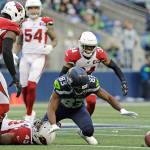 Seattle Seahawks wide receiver David Moore (83) fumbles against the Arizona Cardinals during the second half of Sundays game in Seattle. (AP Photo/Lindsey Wasson)
