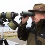 Rick Taylor looks at birds in the water by the Mukilteo Lighthouse Park. (Andy Bronson / Herald file)