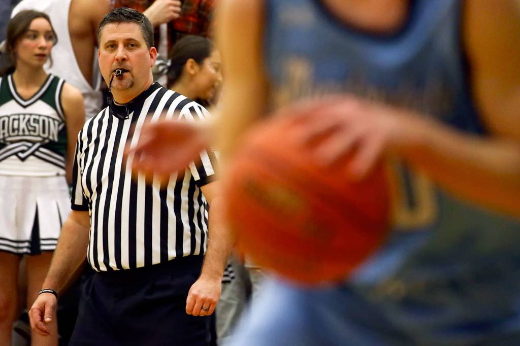 Mark Myers keeps an eye on the action during a Dec. 13 non-conference game between Meadowdale and host Jackson in Mill Creek. (Kevin Clark / The Herald)