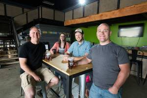 Adam Hayes, Emily Longbow, brewmaster Will Hezlep and John Caruthers at the Lost Canoe Brewing Co. on Wednesday, May 24, 2017 in Snohomish, Wa. (Andy Bronson / The Herald)