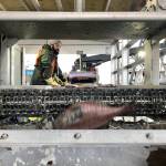 In this Dec. 11 photo, a worker sorts fish being unloaded from a bottom trawler containing rockfish and other groundfish species in Warrenton, Oregon. (AP Photo/Gillian Flaccus)