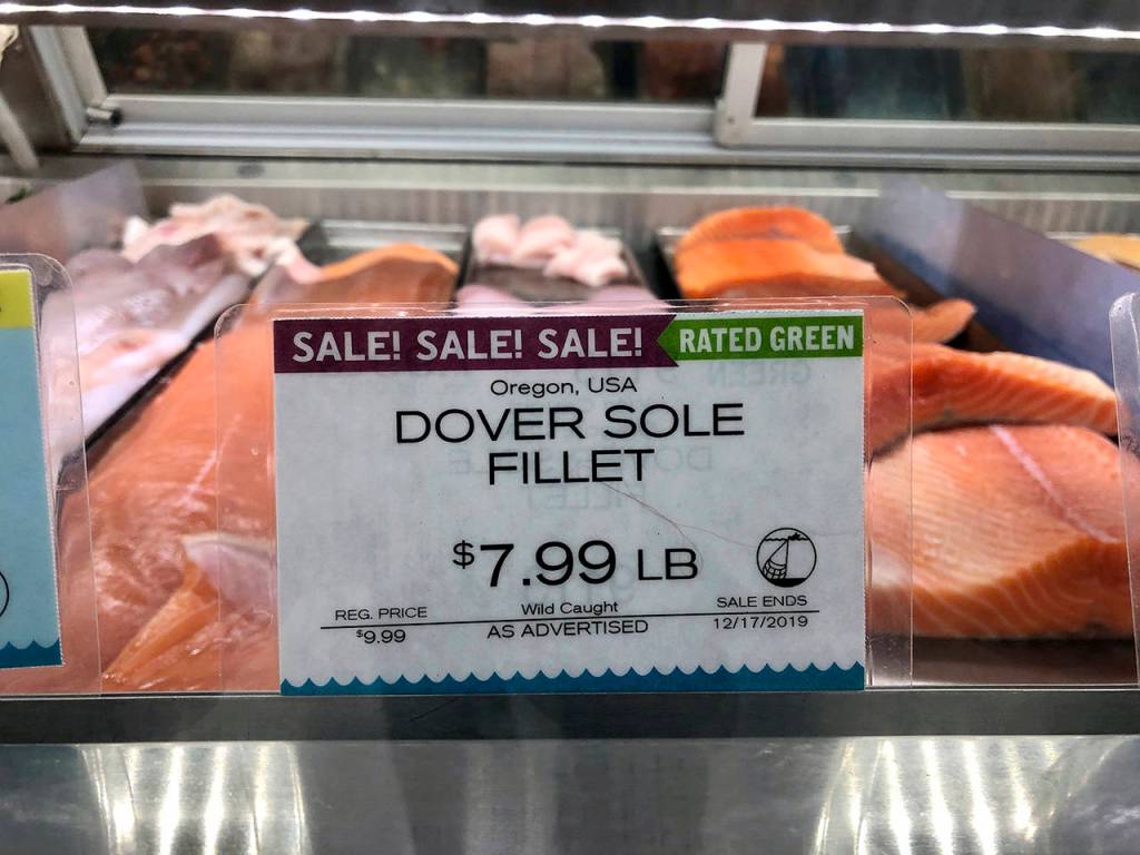 In this Dec. 17 photo, wild-caught Dover sole from Oregon waters is sold in a grocery store seafood case in Lake Oswego, Oregon. (AP Photo/Gillian Flaccus)