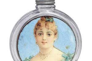 This round flask with a label under the glass pictures a girl