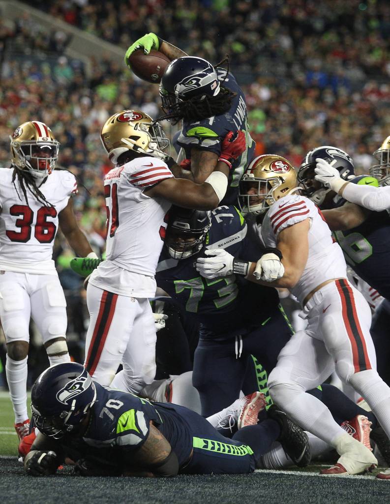 Seattle Seahawks Marshawn Lynch reaches up and over for a touchdown as the Seattle Seahawks lost to the San Francisco 49ers 26-21 at CenturyLink Field on Sunday, Dec. 29, 2019 in Seattle, Wash. (Andy Bronson / The Herald)