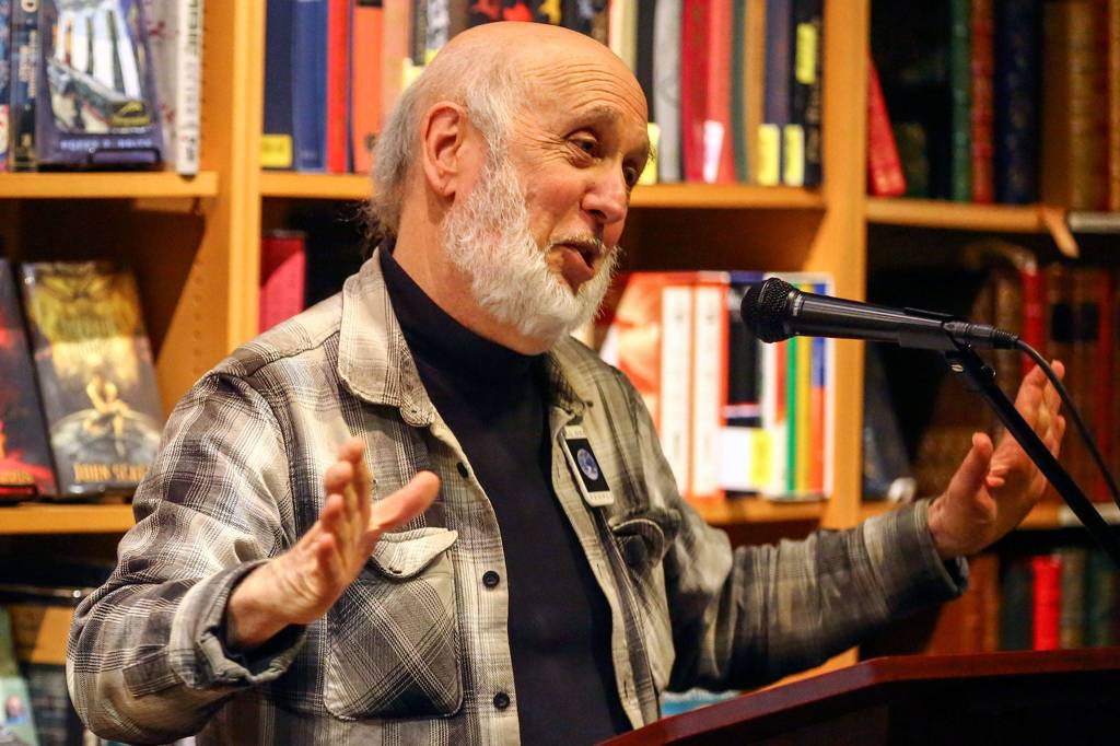 Steven Greenebaum talks about his new book, One Family: Indivisible, at Third Eye Books in Lake Forest Park. (Kevin Clark / Herald file)