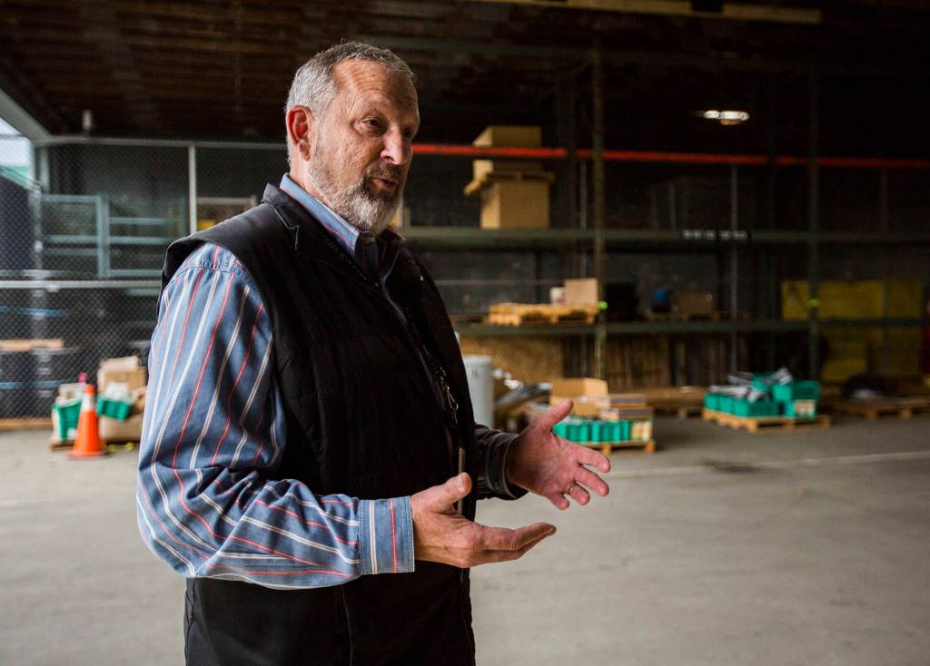 Warehouse manager Hillary Hud Allworth talks about storm baskets and how the are utilized during a storm at the Snohomish County PUD Operations Center in Everett. (Olivia Vanni / Herald file)