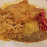 Santa Fe Mexican Grills plate of chicken enchiladas is served with the customary side of rice and beans. (Sharon Salyer / The Herald)