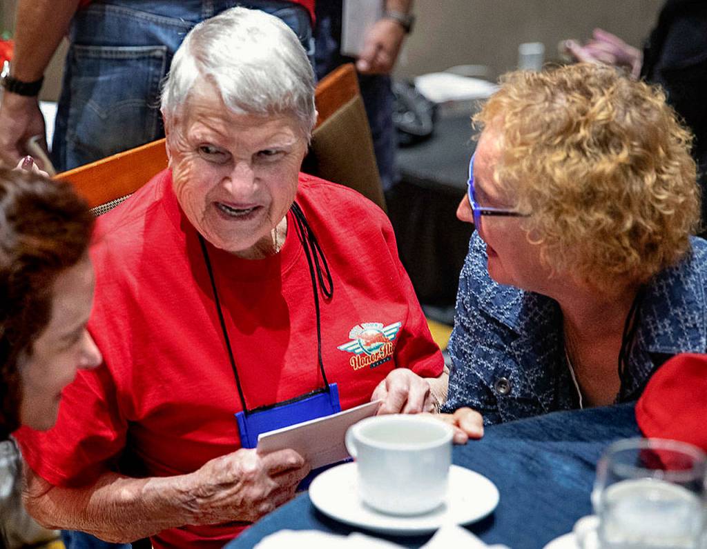 Teresa Schmierer, 100, enjoys a special meal during her Puget Sound Honor Flight trip to Washington, D.C., in September. At her right is her friend Kim Pontrello, who regularly takes Schmierer to a water aerobics class in Everett. The elderly woman served as a Navy nurse during World War II. (Puget Sound Honor Flight)