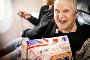 Teresa Schmierer, a 100-year-old Navy nursing veteran, aboard a plane during her trip last September with Puget Sound Honor Flight. The nonprofit group provides free trips to Washington, D.C., to see the nations memorials. (Puget Sound Honor Flight)