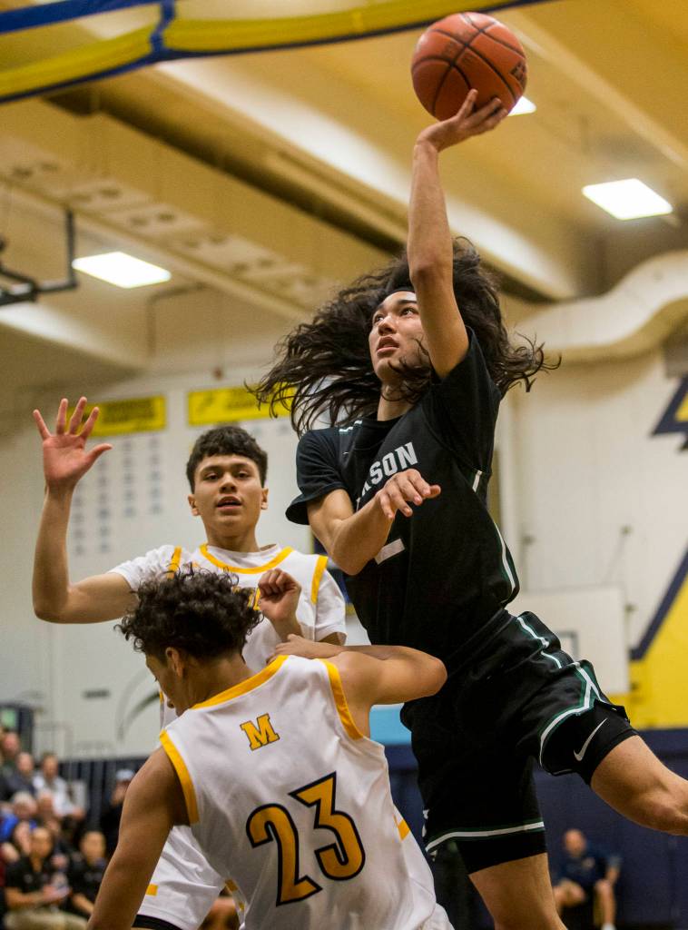 Jacksons Jesse Hoiby attempts a layup during the game at Mariner High School on Friday in Everett. (Olivia Vanni / The Herald).