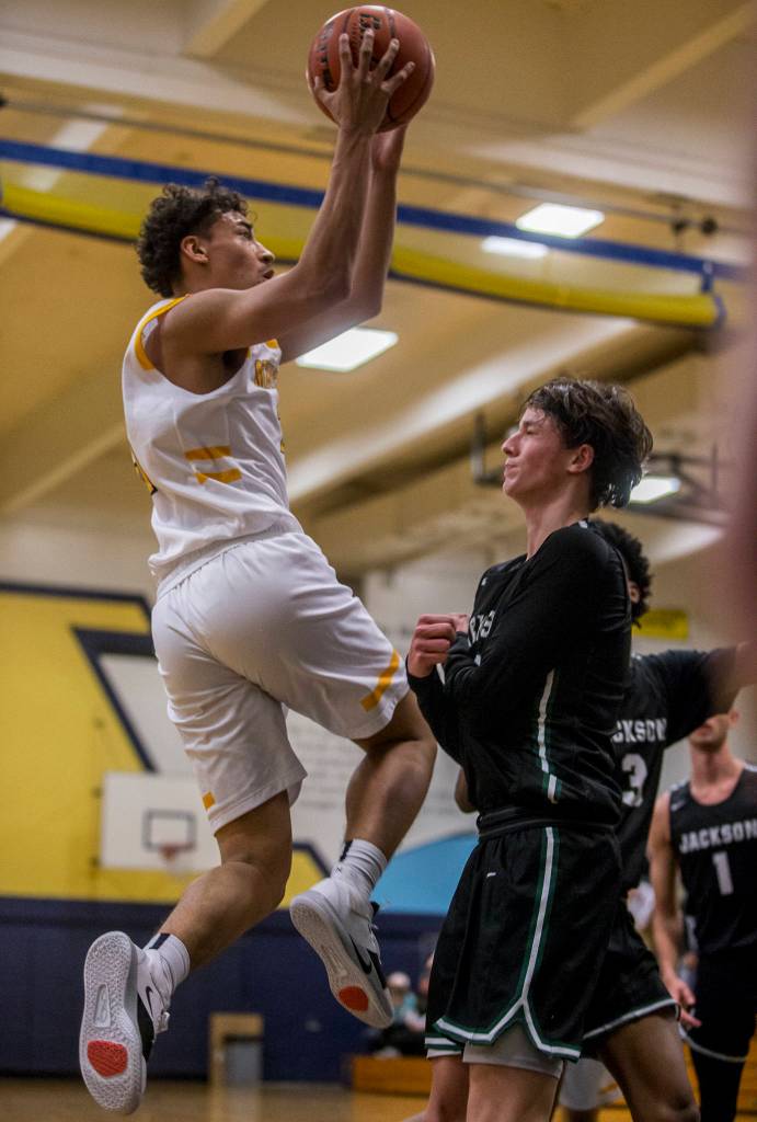 Mariners Tony MacArthur makes a jump shot during the game at Mariner High School on Friday in Everett. (Olivia Vanni / The Herald).