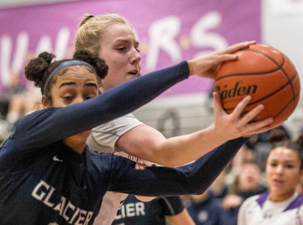 Lake Stevens Chloe Pattison fights for the ball with Glacier Peaks Aaliyah Collins during the game at Lake Stevens High School on Saturday, Jan. 4, 2020 in Lake Stevens, Wash. (Olivia Vanni / The Herald).