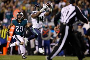 Seattle wide receiver D.K. Metcalf catches a touchdown pass as Philadelphia Eagles Avonte Maddox trails during the second half of Sundays NFC wild-card game in Philadelphia. (AP Photo/Matt Rourke)