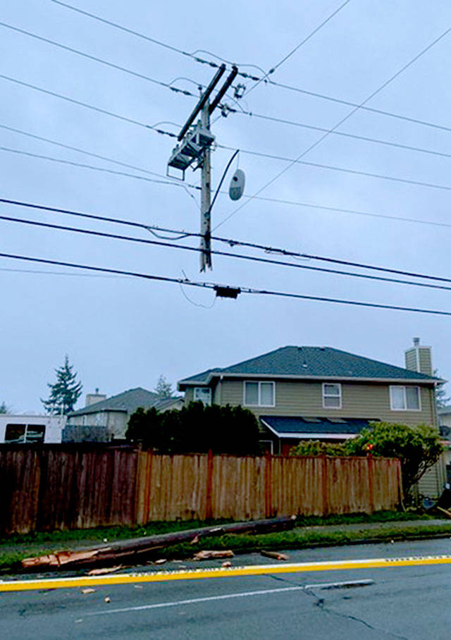 A car sheared this power pole before crashing into a house and starting a fire in Mountlake Terrace Monday. One person in the car died. (South County Fire)