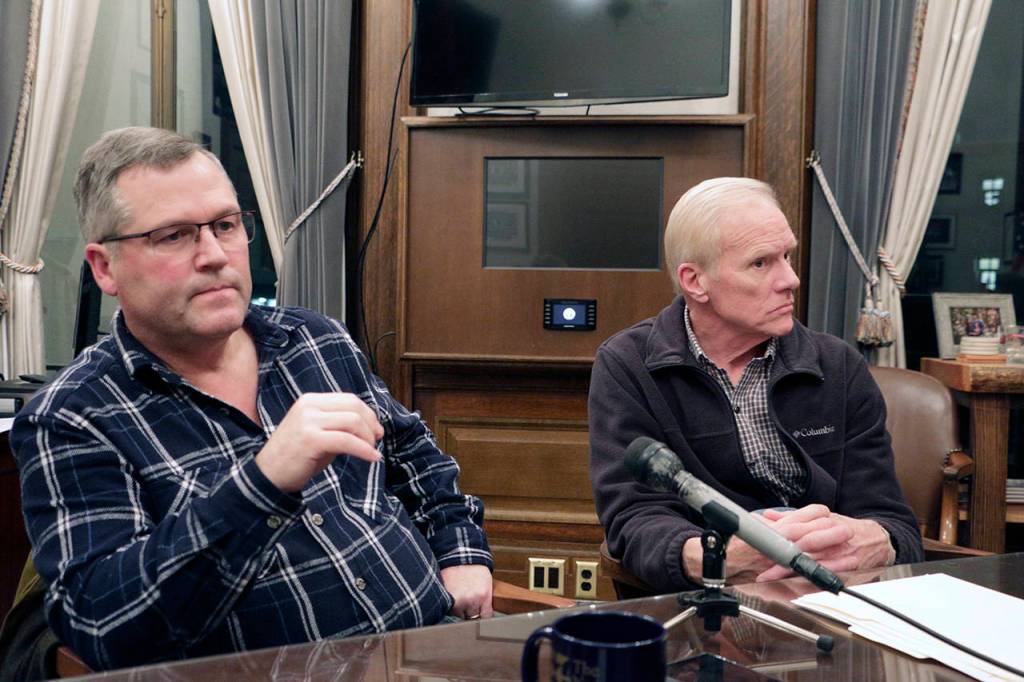 House Republican Leader J.T. Wilcox, left) and caucus chair Rep. Paul Harris talk to the media Dec. 19 in Olympia. Wilcox has called on Republican Rep. Matt Shea to resign following an investigative report that found he took part in domestic terrorism against the United States during a 2016 standoff at a wildlife refuge in Oregon. (AP Photo/Rachel La Corte)