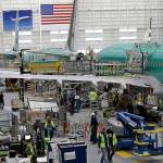 In this 2019 photo, people work on the Boeing 737 Max 8 assembly line during a brief media tour in Boeings 737 assembly facility in Renton. (AP Photo/Ted S. Warren, File)